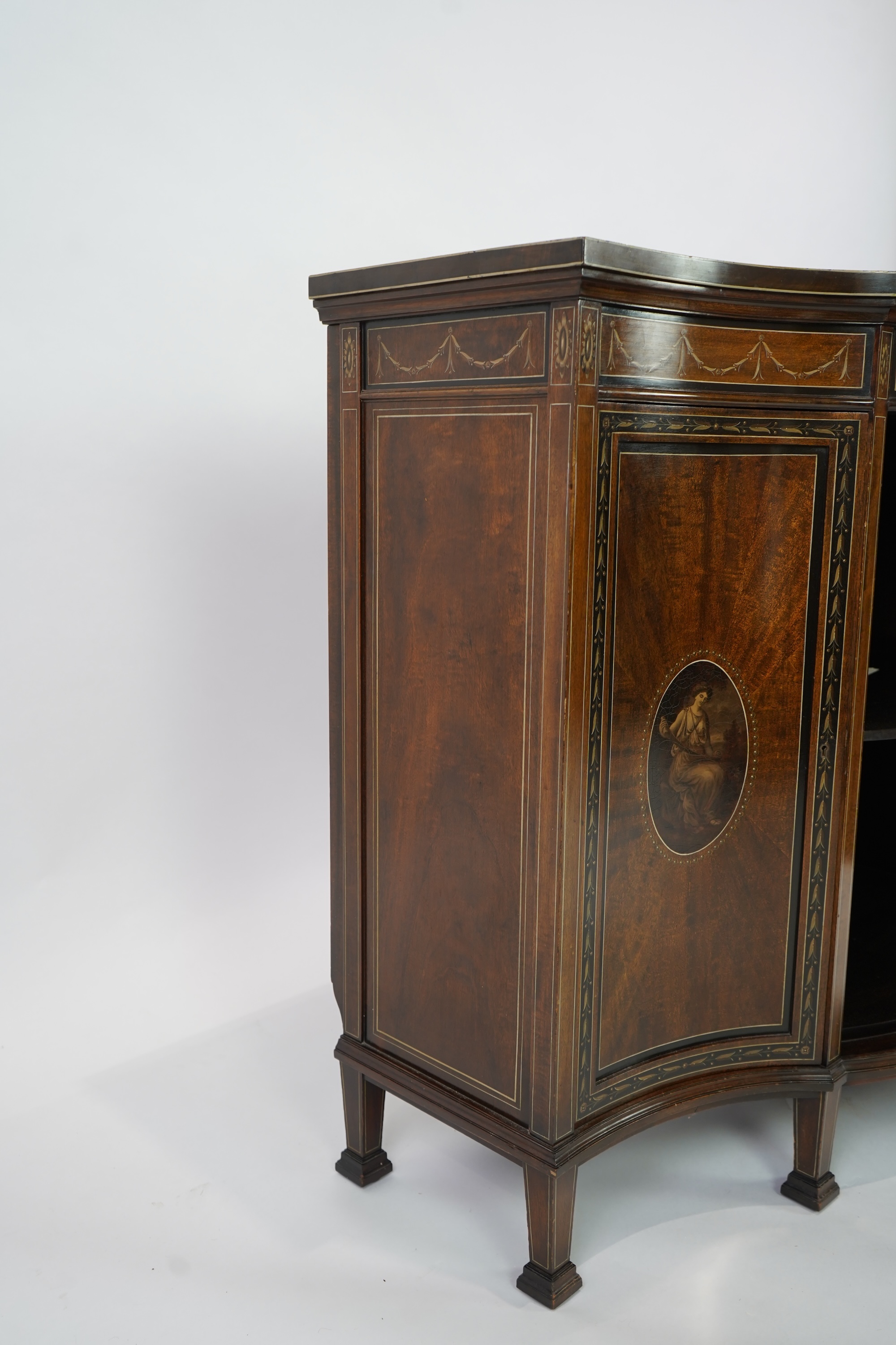 An Edwardian Sheraton Revival painted mahogany bowfront side cabinet